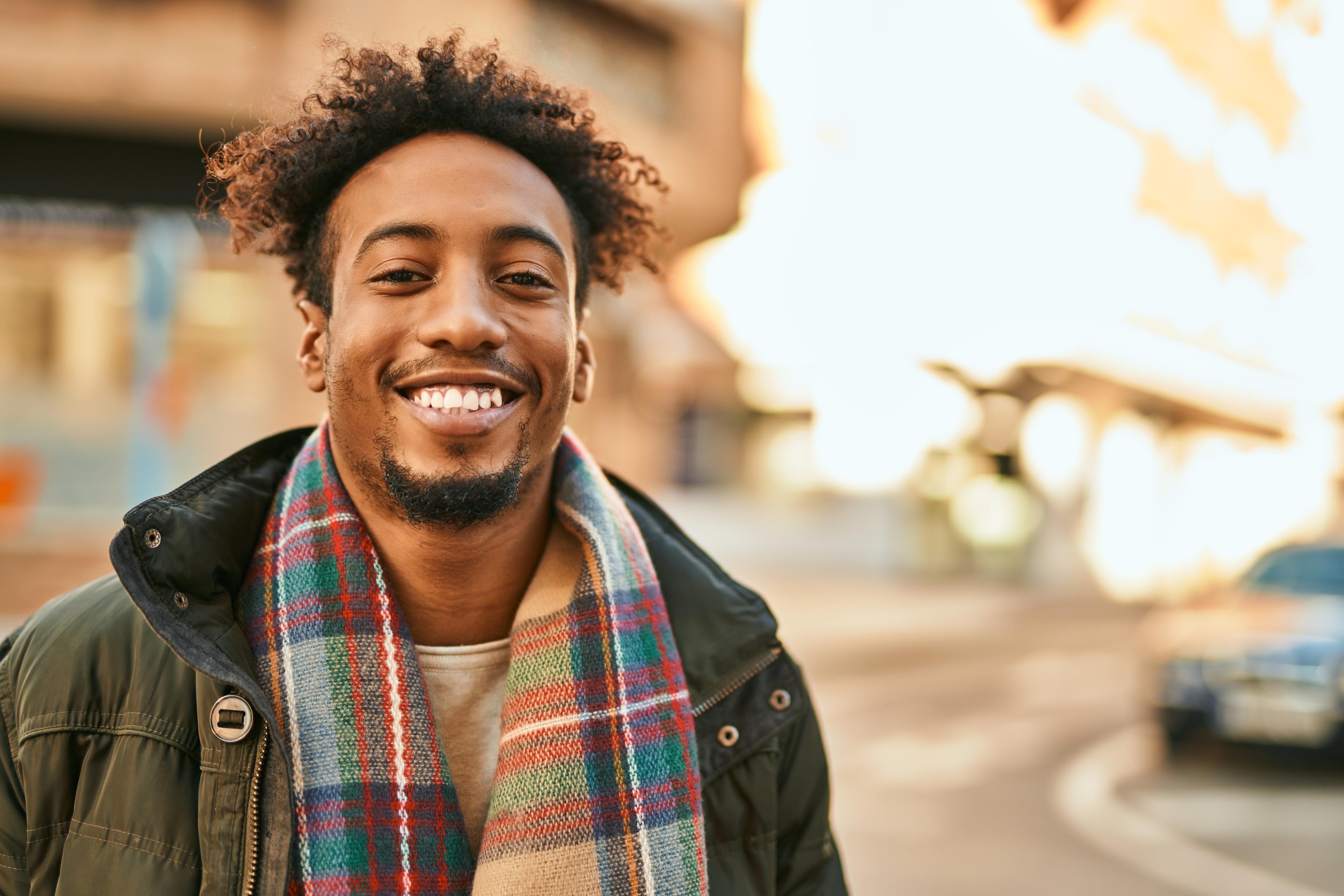 smiling man with scarf
