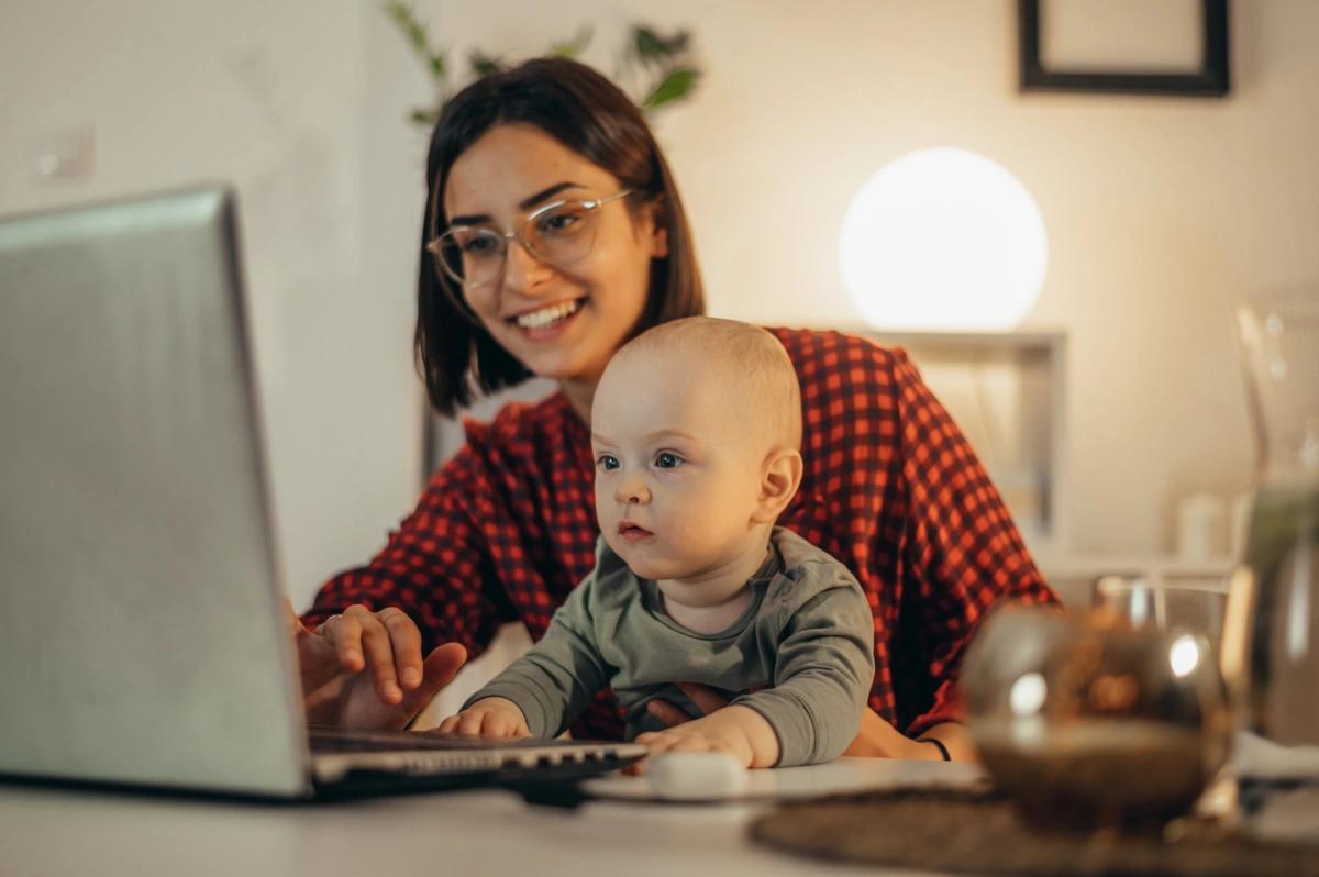 mother on computer with baby
